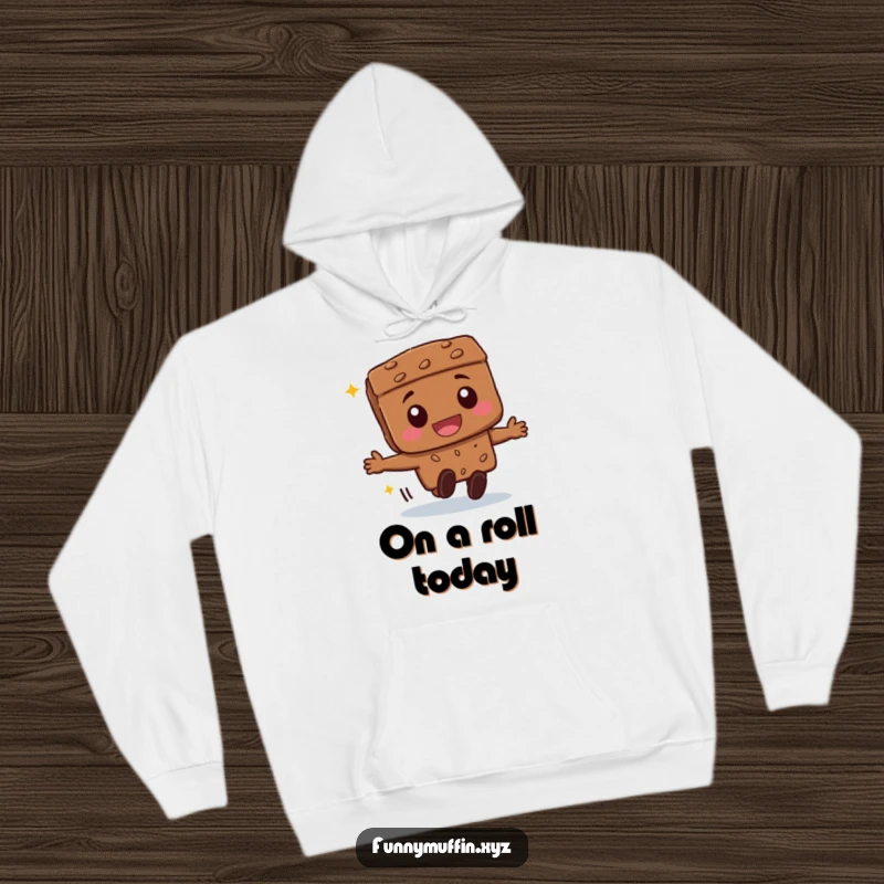 Funny beaming brownie character hoodie, joyfully rolling forward, offering cozy warmth and a dose of sweet humor.