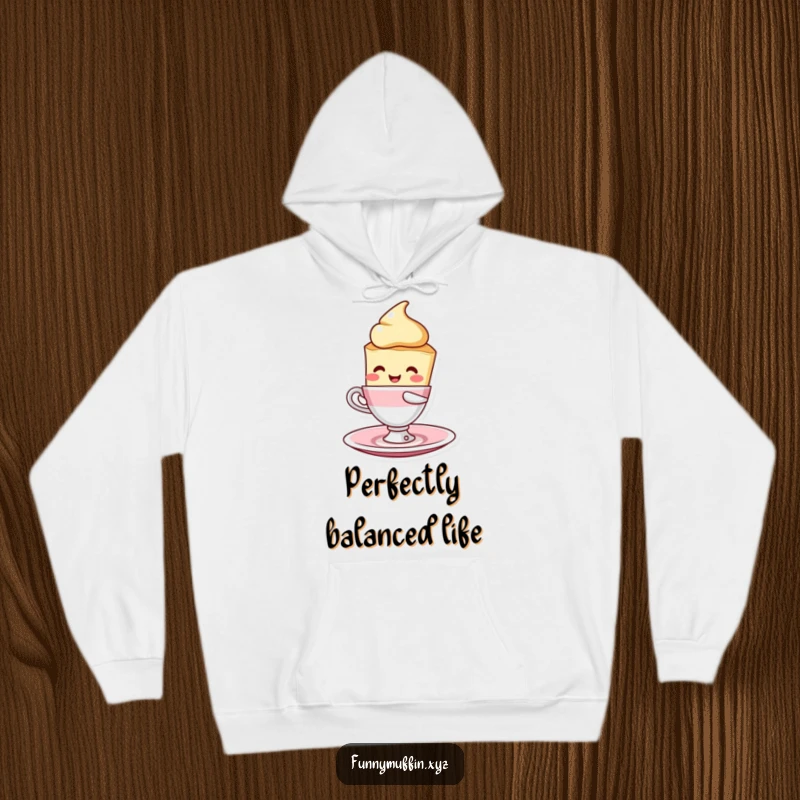 Funny scone character hoodie, humorously balancing a cup and saucer, designed for ultimate cozy and comical enjoyment.